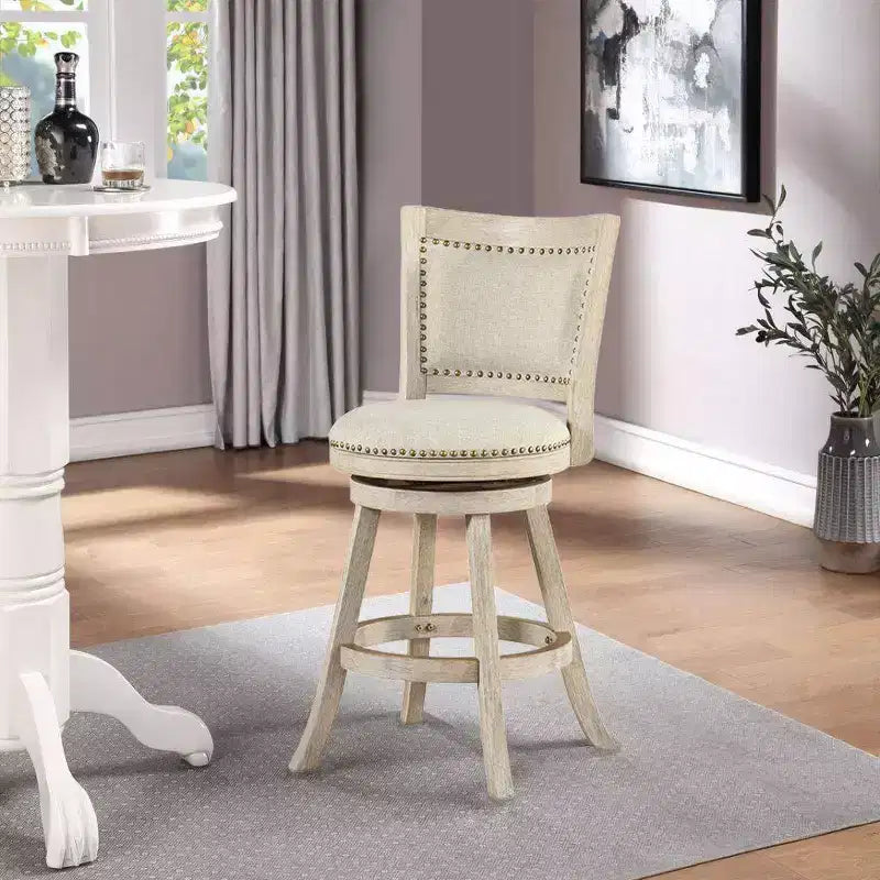 Sgabello da bar girevole Melrose da 24" ad altezza bancone con finitura spazzolata Ivory - Boraam: Rivestimento in lino, borchie decorative